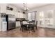 Cozy kitchen nook features white cabinets, modern appliances, and a bright breakfast nook for casual dining at 4706 E Des Moines St, Mesa, AZ 85205
