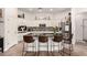 Modern kitchen with granite counters, stainless steel appliances, and spacious island with seating at 4706 E Des Moines St, Mesa, AZ 85205