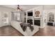 Bright and airy living room with a cozy fireplace, built-in shelving, and a comfortable sectional sofa at 4706 E Des Moines St, Mesa, AZ 85205