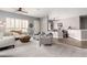 Bright and airy living room showcasing modern décor, plush seating, and ample natural light at 4706 E Des Moines St, Mesa, AZ 85205