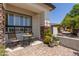 Cozy side patio with brick pavers, perfect for enjoying morning coffee at 4706 E Des Moines St, Mesa, AZ 85205
