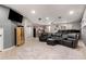 Home theater with reclining chairs, large screen, projector, and kitchenette, ideal for entertaining at 4706 E Des Moines St, Mesa, AZ 85205