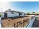 Well-kept single-story home featuring a low-maintenance, xeriscaped front yard and secure fence at 4750 N 50Th Ave, Phoenix, AZ 85031