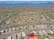 Real estate aerial view of neighborhood, showing streets, desert landscaping, and tile roofed single Gathering homes at 5049 E Duane Ln, Cave Creek, AZ 85331