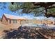 Backyard view with pool, patio, desert landscaping and shade tree at 5049 E Duane Ln, Cave Creek, AZ 85331