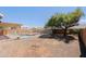 Backyard featuring a fence, large tree and desert landscaping at 5049 E Duane Ln, Cave Creek, AZ 85331