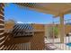 Covered barbecue area with view of the outdoor pool and backyard at 5049 E Duane Ln, Cave Creek, AZ 85331