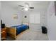 Cozy bedroom with a ceiling fan, window with shutters, and a wooden bed frame at 5049 E Duane Ln, Cave Creek, AZ 85331