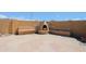 Backyard fireplace with built-in seating area and custom stone pavers at 5049 E Duane Ln, Cave Creek, AZ 85331
