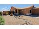 Well-maintained home featuring desert landscaping, a rock garden, and a welcoming entrance at 5049 E Duane Ln, Cave Creek, AZ 85331