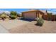 Exterior view of a home featuring a driveway, garage, desert landscaping, and gravel at 5049 E Duane Ln, Cave Creek, AZ 85331