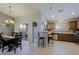 Spacious kitchen and dining area, featuring stainless steel appliances and a seamless transition to an outdoor patio at 5049 E Duane Ln, Cave Creek, AZ 85331
