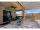 Beautiful covered patio featuring a ceiling fan, outdoor seating, and a built-in grill at 5049 E Duane Ln, Cave Creek, AZ 85331