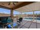 Beautiful covered patio with outdoor seating and barbecue with view of swimming pool at 5049 E Duane Ln, Cave Creek, AZ 85331