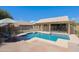 Fenced-in swimming pool adjacent to covered patio and backyard at 5049 E Duane Ln, Cave Creek, AZ 85331