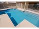 Inviting swimming pool featuring custom stonework and nearby covered patio at 5049 E Duane Ln, Cave Creek, AZ 85331