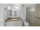 Bathroom features a glass enclosed shower with stone accents and granite vanity at 5229 W Palo Verde Ave, Glendale, AZ 85302