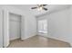 Bedroom with tile floors, closet, ceiling fan and bright light at 5229 W Palo Verde Ave, Glendale, AZ 85302