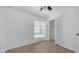 Bedroom with tile floors, window, ceiling fan and closet at 5229 W Palo Verde Ave, Glendale, AZ 85302