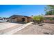 Home exterior showcasing a carport and desert landscaping at 5229 W Palo Verde Ave, Glendale, AZ 85302
