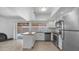 Modern kitchen featuring stainless steel appliances, granite countertops, and ample cabinet space at 5229 W Palo Verde Ave, Glendale, AZ 85302