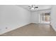 Living room with tile floors and sliding glass doors to the patio at 5229 W Palo Verde Ave, Glendale, AZ 85302