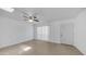 Bright, airy living room with tile floors, ceiling fan, and sliding glass door with vertical blinds at 5229 W Palo Verde Ave, Glendale, AZ 85302
