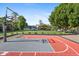 Backyard includes a well-maintained basketball court adjacent to the lush lawn and home at 5339 E Osborn Rd, Phoenix, AZ 85018