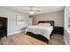Cozy bedroom featuring hardwood floors and natural light at 5339 E Osborn Rd, Phoenix, AZ 85018
