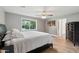 Bright bedroom featuring a window with a view of the yard and hardwood floors at 5339 E Osborn Rd, Phoenix, AZ 85018