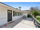 Inviting front patio features a black door, white brick, and a cozy seating area at 5339 E Osborn Rd, Phoenix, AZ 85018