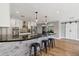 Open-concept kitchen with a large island featuring bar seating and a decorative wood accent at 5339 E Osborn Rd, Phoenix, AZ 85018