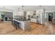 Contemporary kitchen boasts white cabinets, black countertops, an island, and stainless steel appliances at 5339 E Osborn Rd, Phoenix, AZ 85018