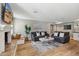 Cozy living room featuring hardwood floors, a decorative fireplace, and ample seating at 5339 E Osborn Rd, Phoenix, AZ 85018