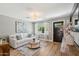 Bright living room showcasing a white sofa, wood floors, a neutral rug, and front door at 5339 E Osborn Rd, Phoenix, AZ 85018