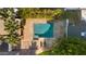 Aerial view of a private backyard pool surrounded by lush landscaping and a stone patio at 5339 E Osborn Rd, Phoenix, AZ 85018