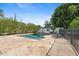 Sparkling pool surrounded by stone patio and lush greenery, creating a private oasis at 5339 E Osborn Rd, Phoenix, AZ 85018