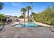 Stunning pool area with stone patio, palm trees, and views of the beautiful backyard and property at 5339 E Osborn Rd, Phoenix, AZ 85018