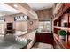 Entertain in this stylish bar area featuring granite countertops and custom cabinetry at 5510 N 132Nd Dr, Litchfield Park, AZ 85340
