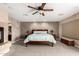 Relax in this spacious bedroom featuring a ceiling fan and neutral decor at 5510 N 132Nd Dr, Litchfield Park, AZ 85340