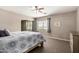 Bright bedroom with mirrored closet, window view, and neutral color palette at 5510 N 132Nd Dr, Litchfield Park, AZ 85340