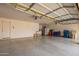 Open garage space featuring high ceilings, built-in lighting, and plentiful storage areas at 5510 N 132Nd Dr, Litchfield Park, AZ 85340
