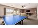 Spacious living room with large windows and comfortable seating at 5510 N 132Nd Dr, Litchfield Park, AZ 85340