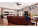 Bright and airy living room showcasing an open layout to the kitchen and textured accent walls at 5510 N 132Nd Dr, Litchfield Park, AZ 85340