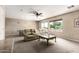 Large living room with a ceiling fan, plush seating and marble table at 5510 N 132Nd Dr, Litchfield Park, AZ 85340