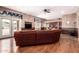 Inviting living room featuring textured walls, hardwood floors, and a built-in bar for entertaining at 5510 N 132Nd Dr, Litchfield Park, AZ 85340