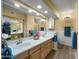 Bathroom featuring dual sinks, a large mirror, and ample counter space at 5830 E Mckellips Rd # 2, Mesa, AZ 85215
