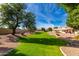 Beautiful community common area with lush lawn and mature trees, perfect for outdoor activities at 5830 E Mckellips Rd # 2, Mesa, AZ 85215