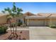 Charming single-story home featuring a tile roof, desert landscaping, and a two-car garage at 5830 E Mckellips Rd # 2, Mesa, AZ 85215