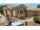 Quaint single-level house with low-maintenance landscaping, stone accents, and a two-car garage at 5830 E Mckellips Rd # 2, Mesa, AZ 85215
